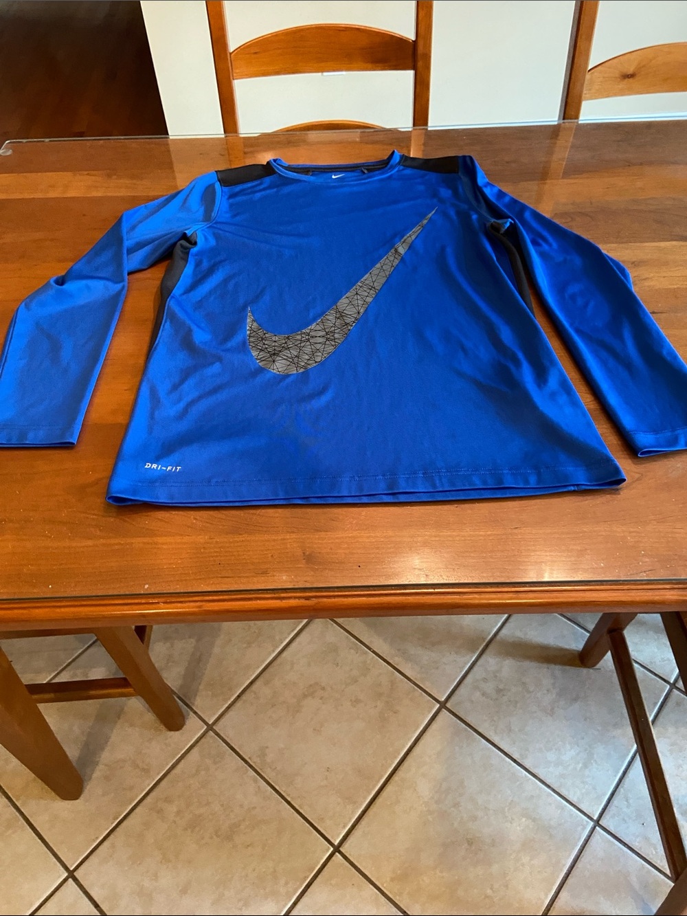 Nike Kids Long-Sleeve Shirt in Royal Blue with Black Swoosh and Side Detail. XL
